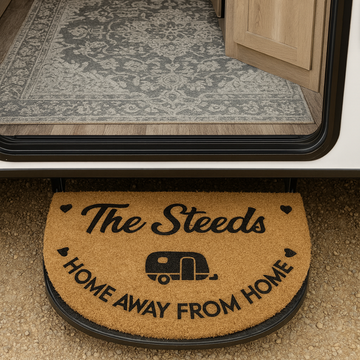 Doormat with 'The Steeds Home Away from Home' text in an RV interior.